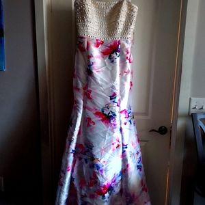 Cream color gown with splash floral print and beaded corset.